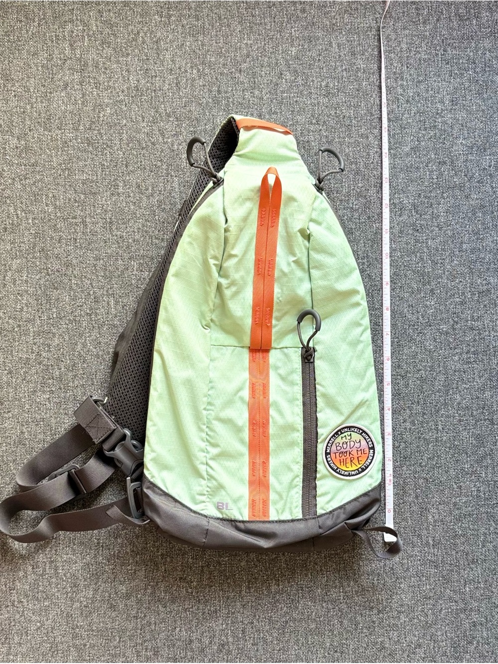 Merrill - Seafoam Green Sling Backpack with Orange Accents